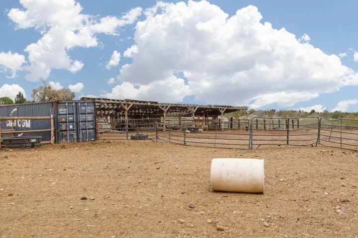 View of yard featuring an outbuilding, an exterior structure, and a view of rural / pastoral area