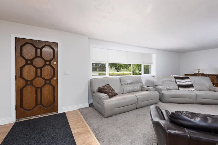 Living area featuring wood finished floors and baseboards