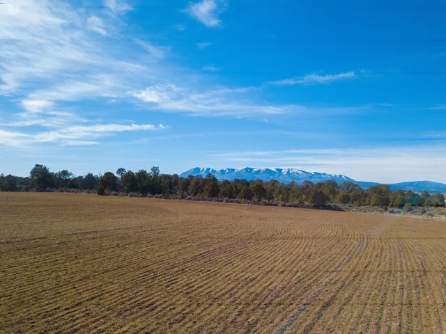 View of mountain background featuring rural landscape