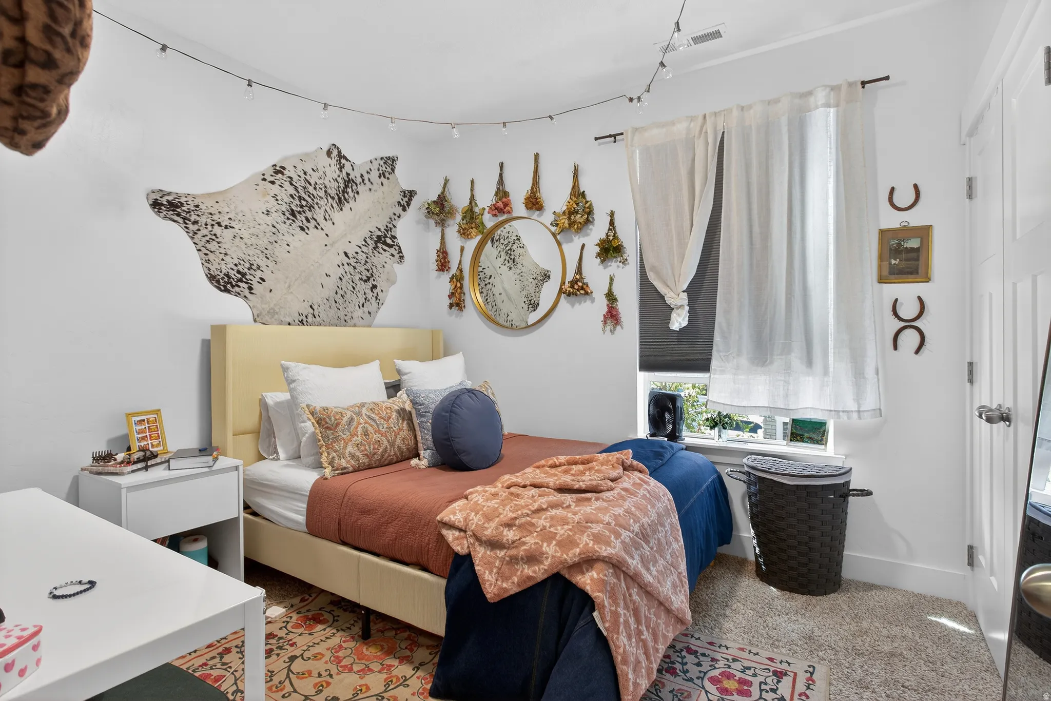 Bedroom with light carpet and baseboards