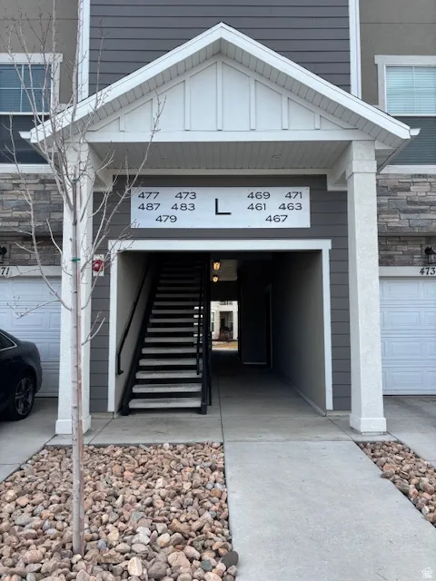 Property entrance featuring stone siding