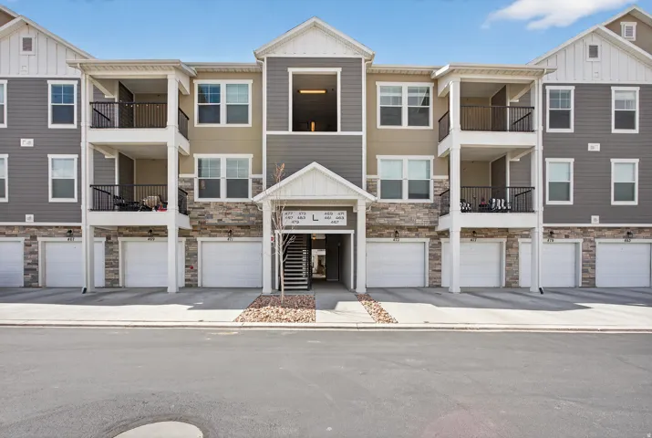 View of building exterior featuring an attached garage
