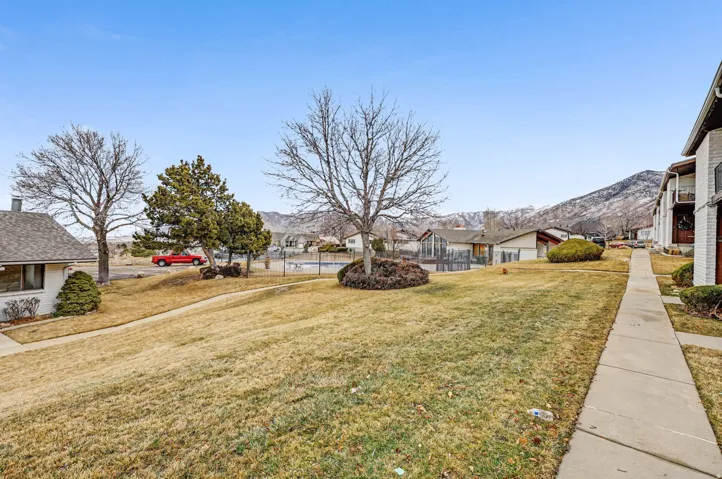 View of yard with a mountain view and a residential view
