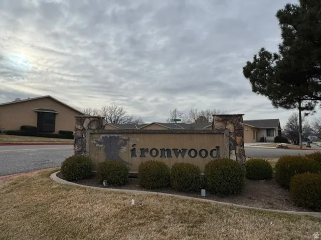 Community / neighborhood sign with a yard