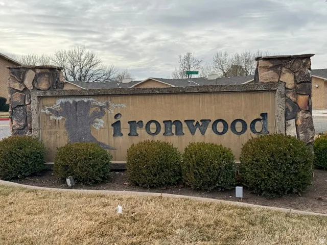Community / neighborhood sign with a lawn