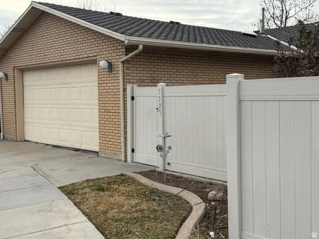 Garage with a gate and driveway