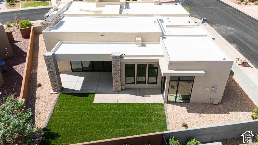 Modern exterior with light stucco finish and flat roof design