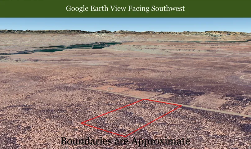 Aerial view of sparsely populated area with a desert landscape and a mountain backdrop