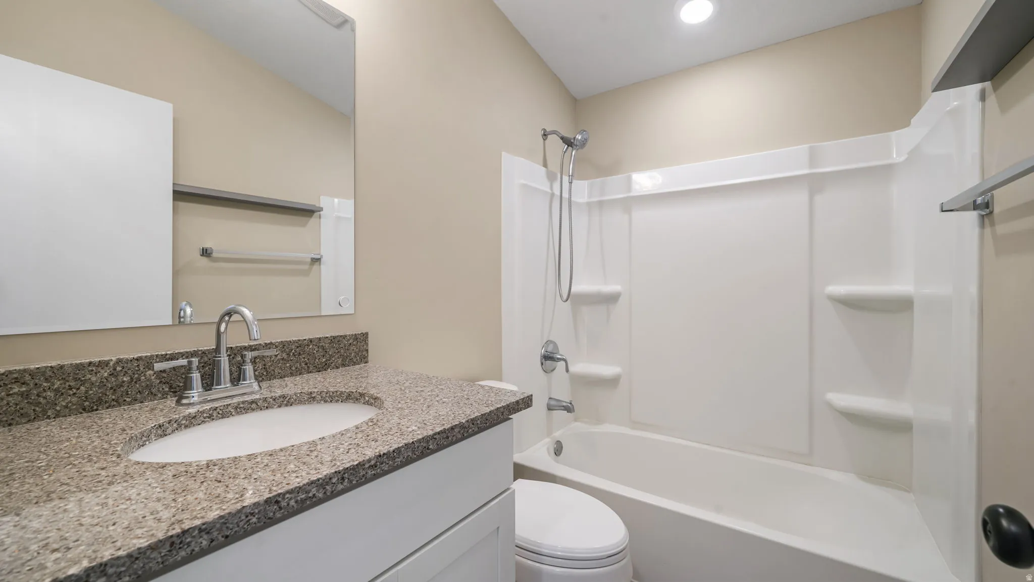 Full bathroom featuring vanity and  shower combination