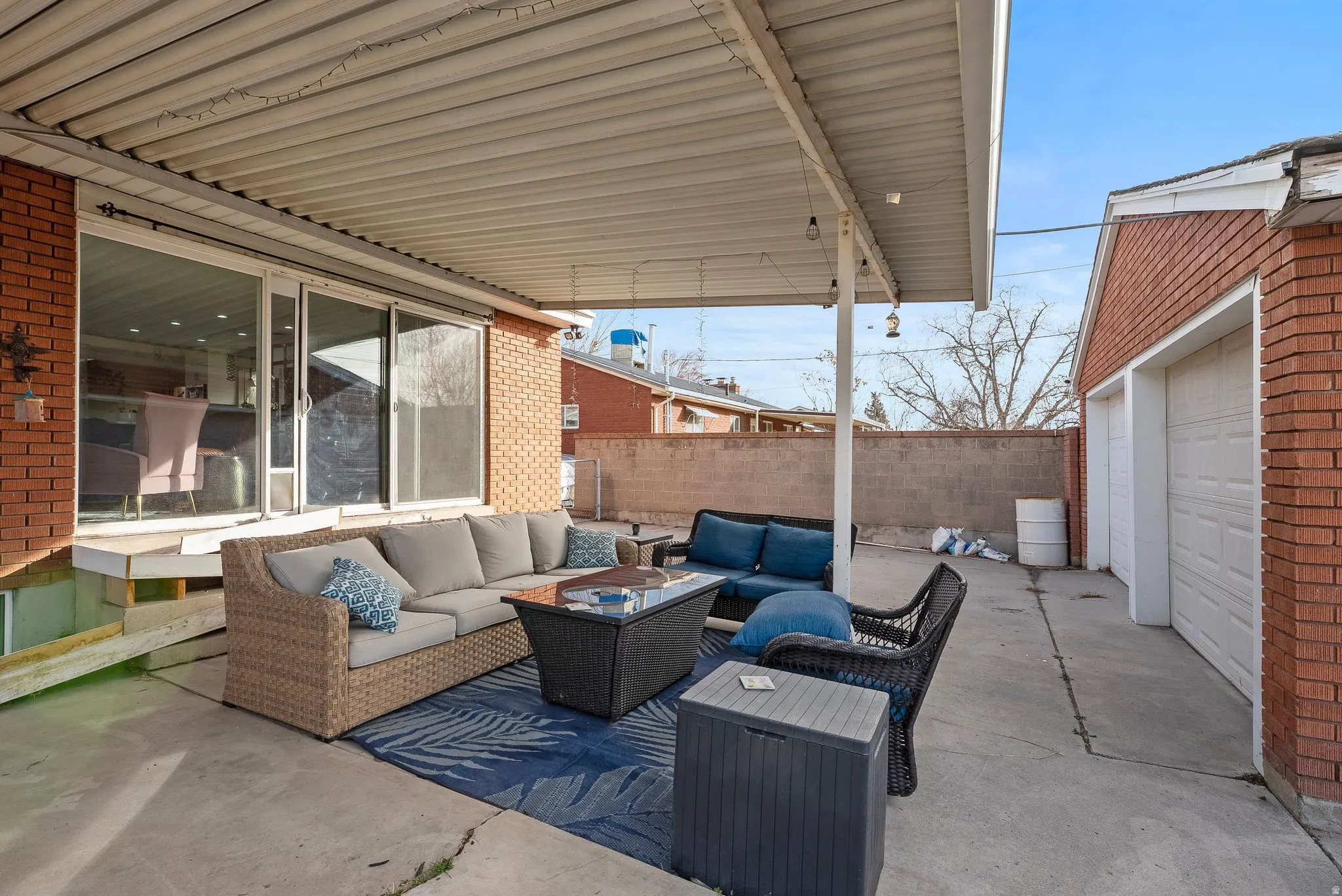 View of patio / terrace featuring outdoor lounge area and a garage