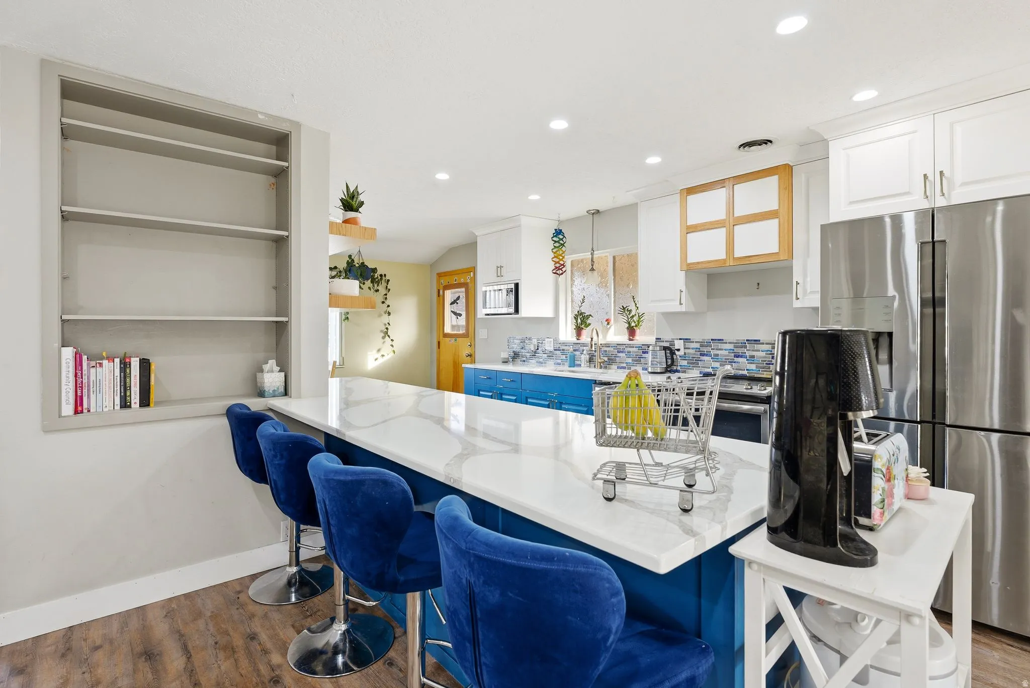 Dual tone kitchen featuring two tone color scheme, stainless steel appliances, dark wood finished floors, open shelves, and recessed lighting