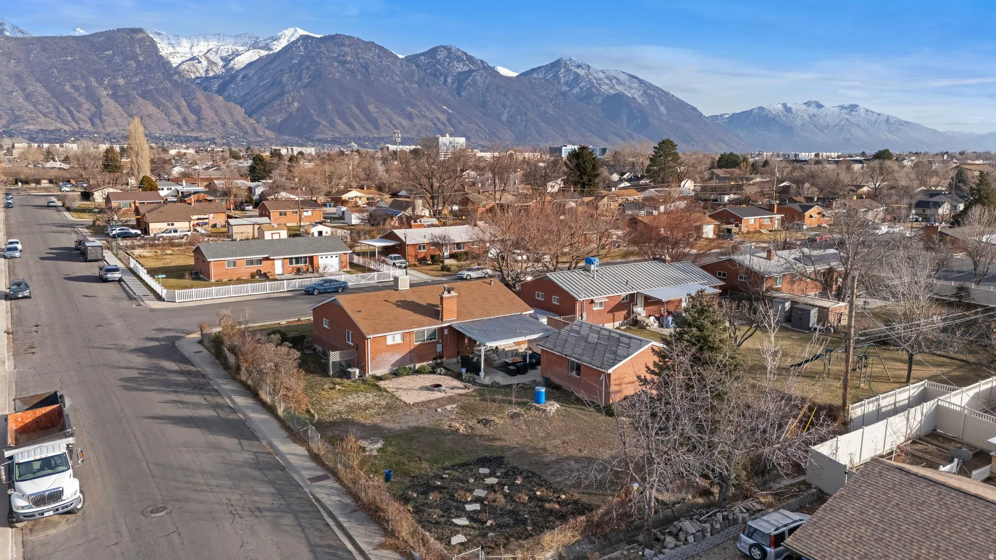 Aerial view of residential area featuring mountains