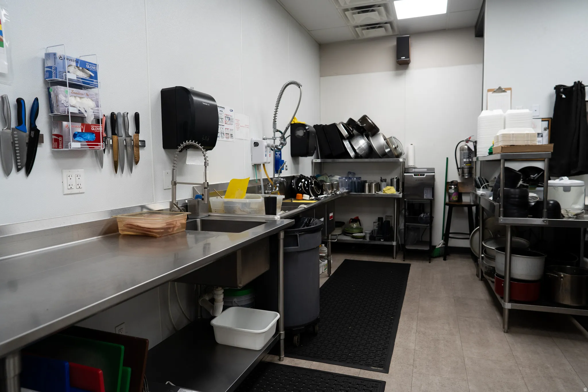 Misc room featuring a sink and a paneled ceiling
