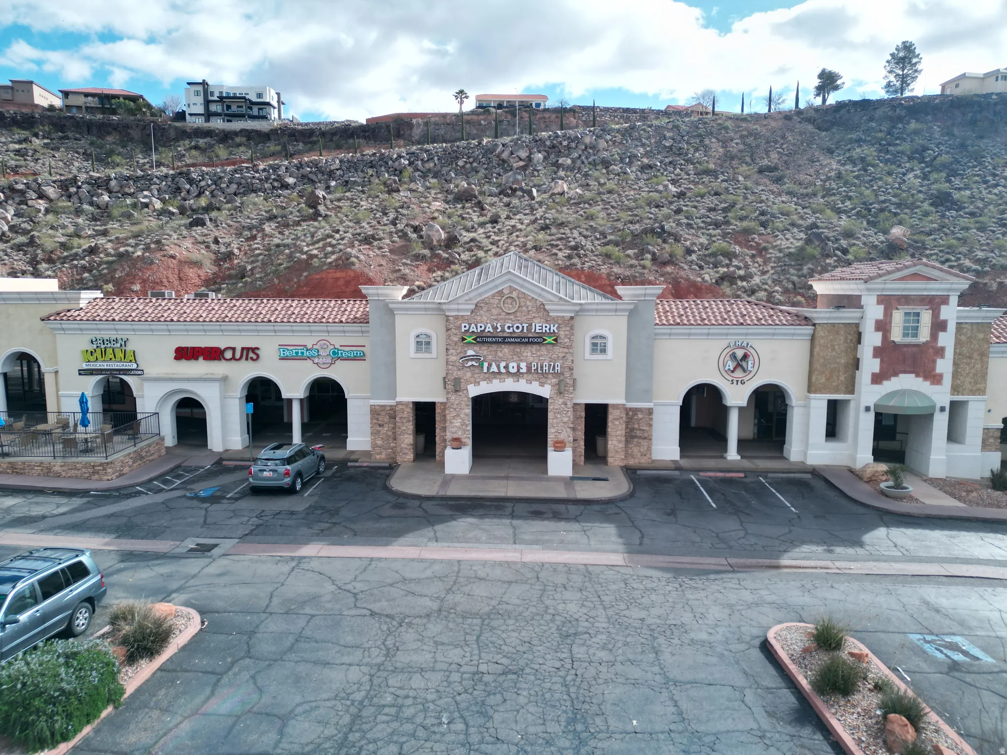 View of commercial location with uncovered parking