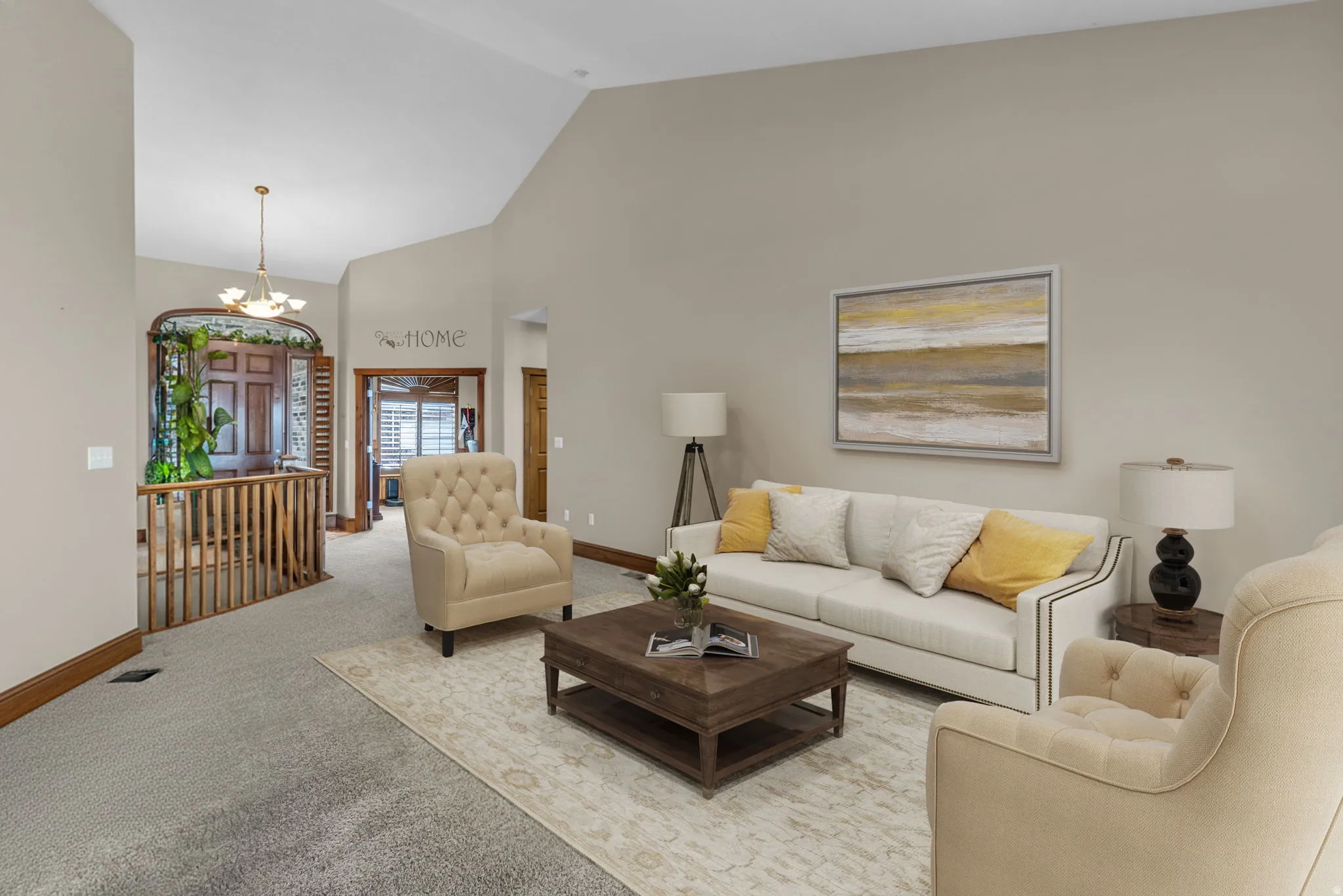 Living room featuring hanging lights, carpet floors, and lofted ceiling