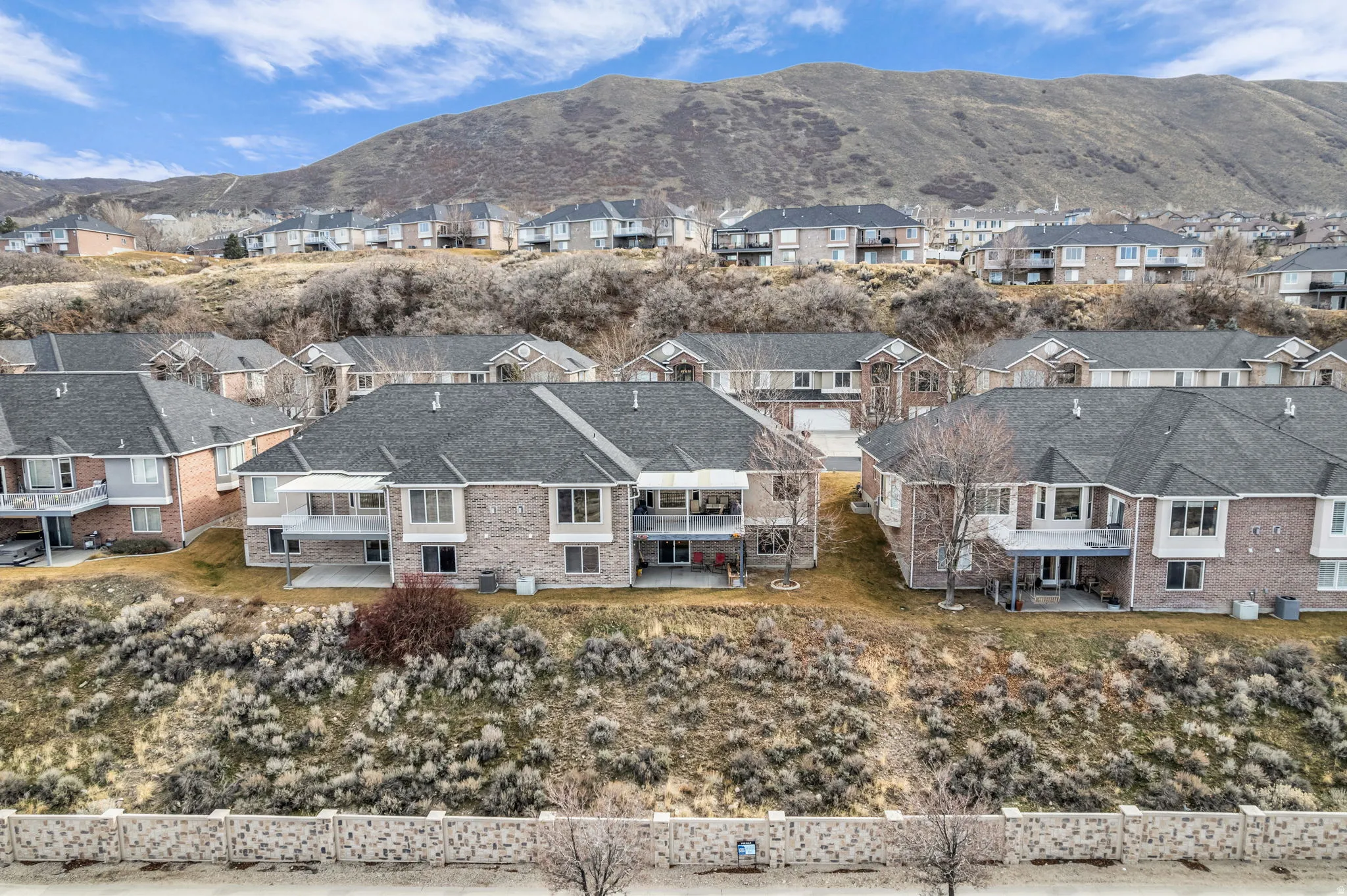 Aerial view of residential area featuring mountains