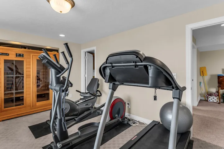 Exercise area with a sauna / steam room