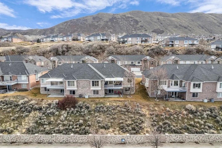 Aerial view of residential area featuring mountains