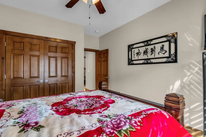 Bedroom featuring a closet and a ceiling fan