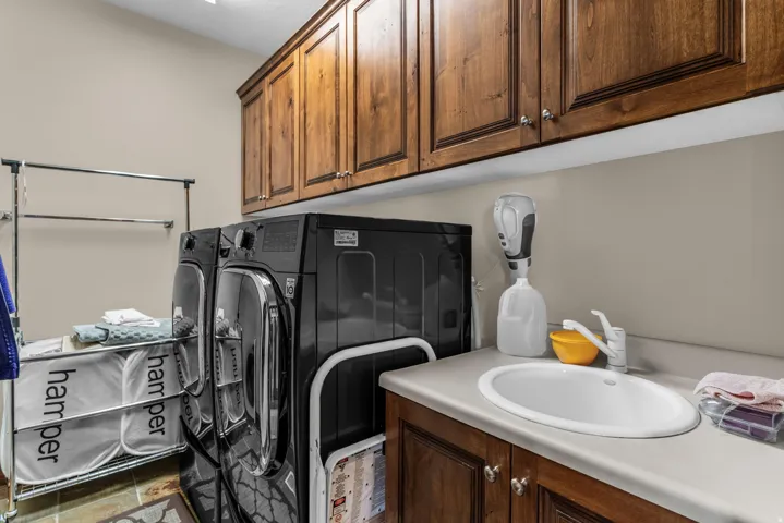Laundry area featuring washing machine and clothes dryer