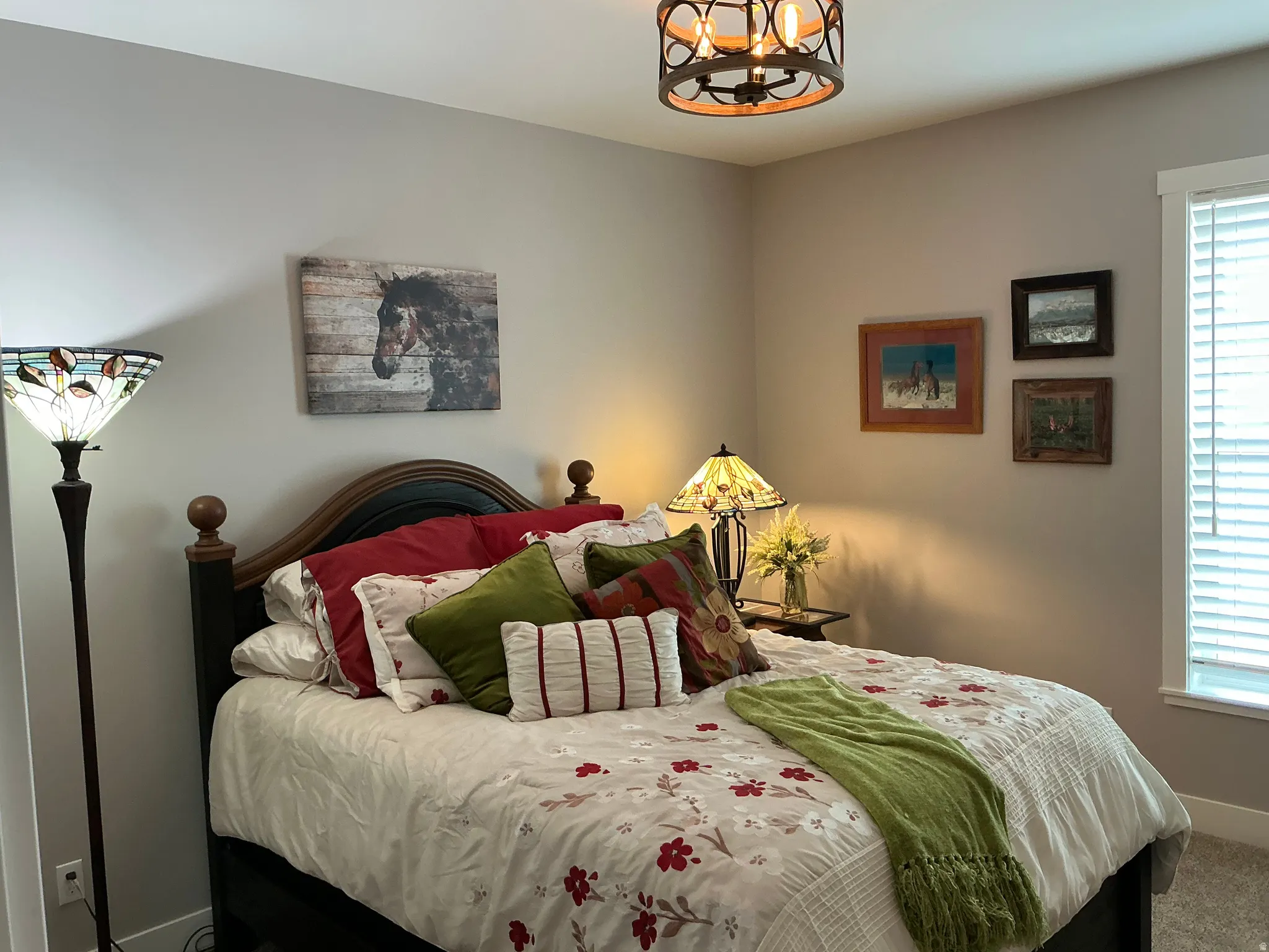 Bedroom with suspended lighting and carpet flooring