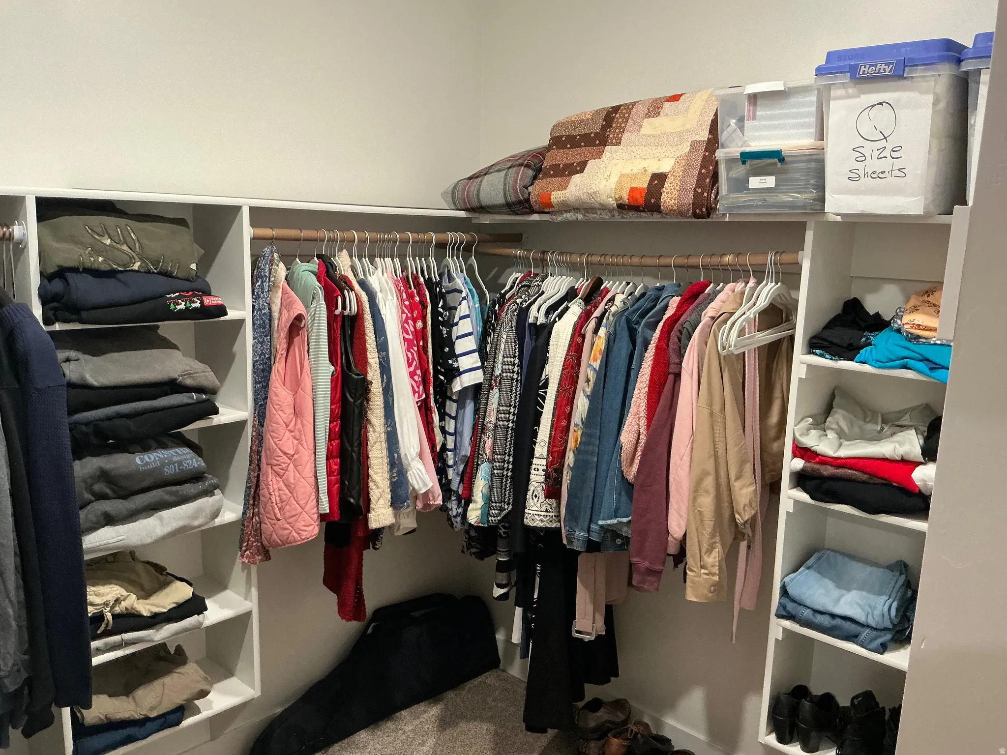 Walk in closet featuring carpet flooring