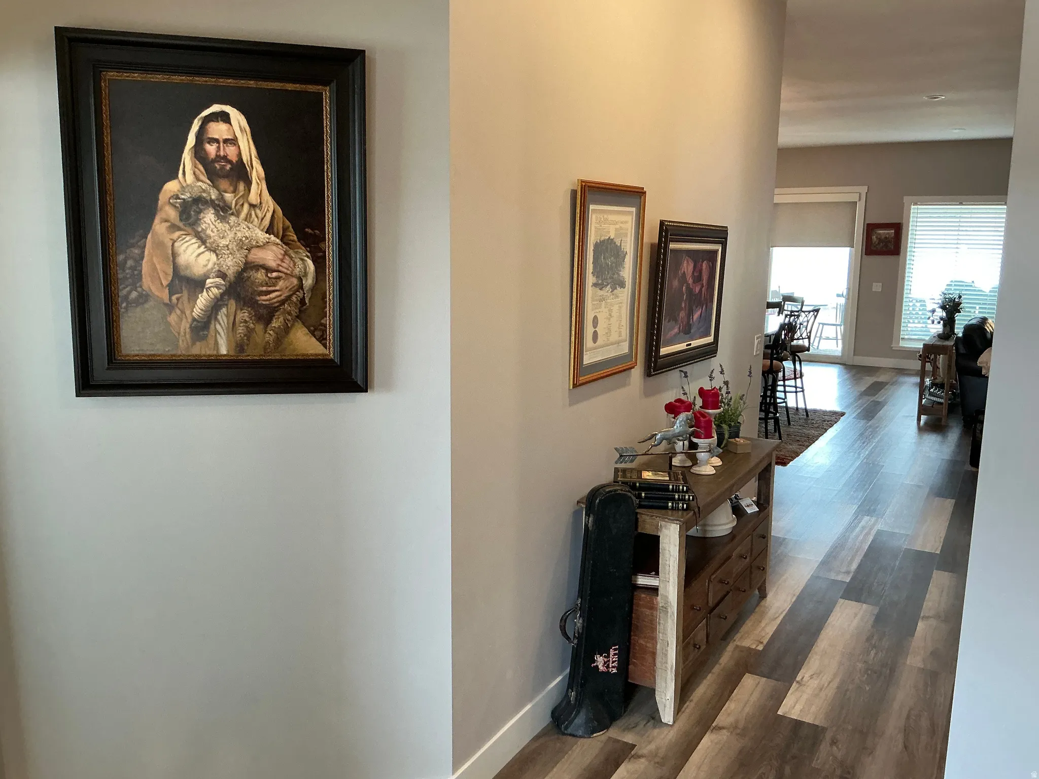 Corridor with dark wood-style floors and baseboards