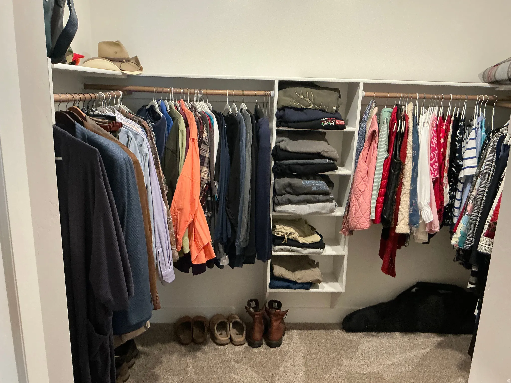 Walk in closet with carpet flooring