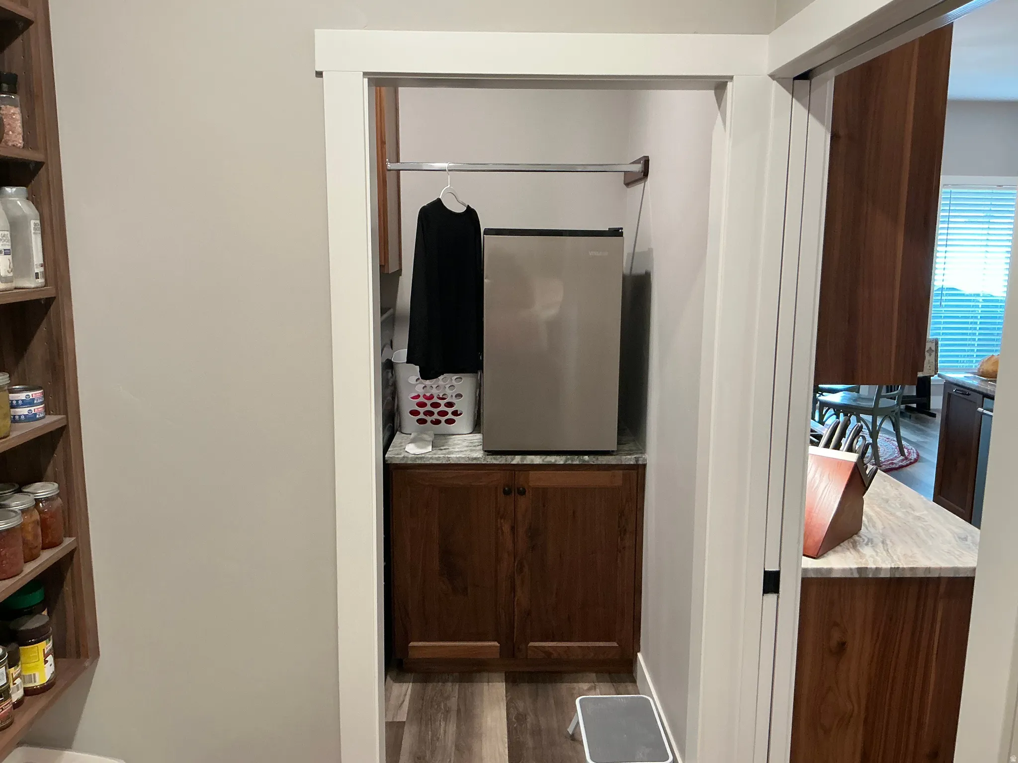Half bathroom featuring dark wood-type flooring and vanity