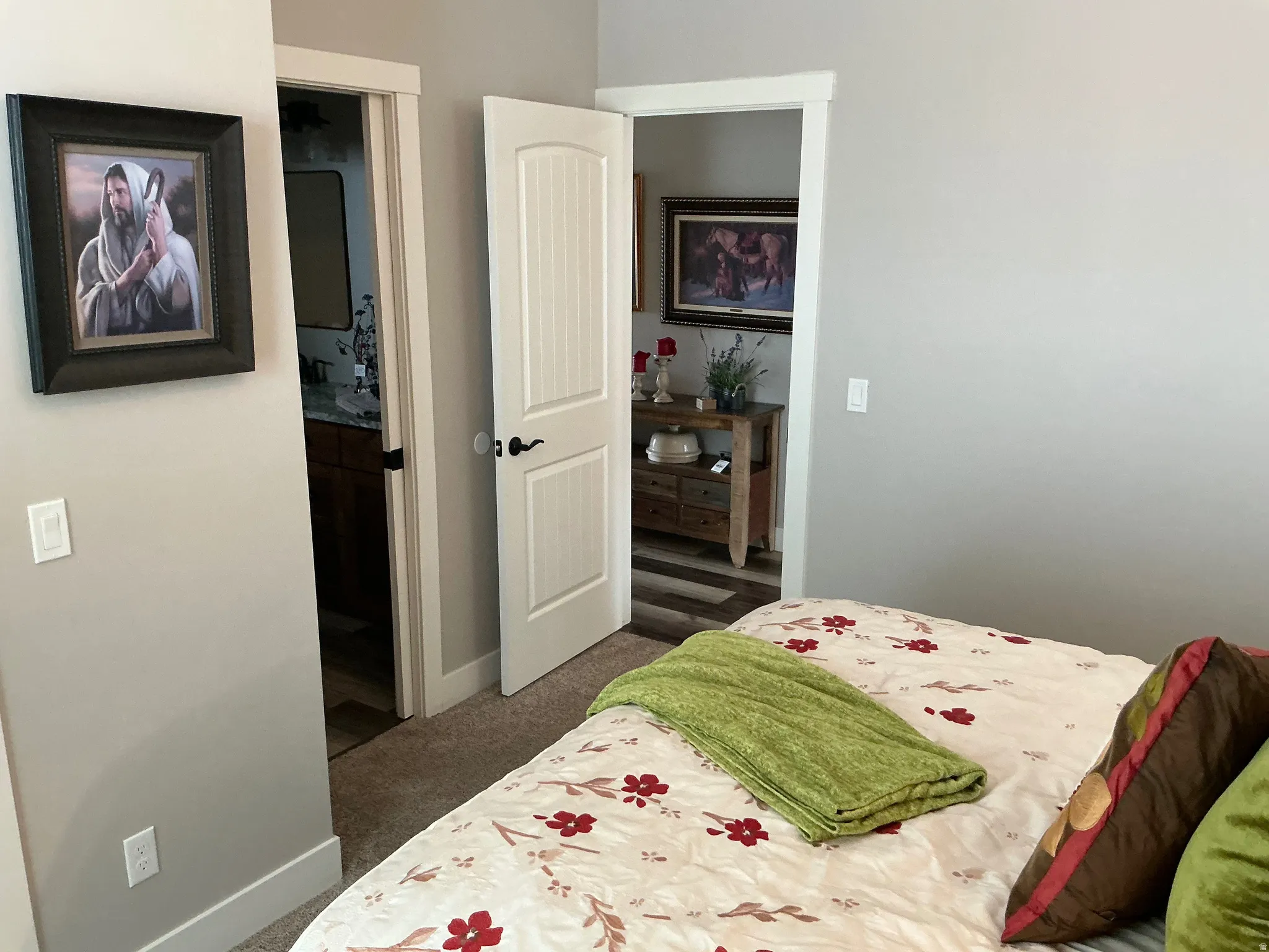 Bedroom featuring baseboards and dark colored carpet
