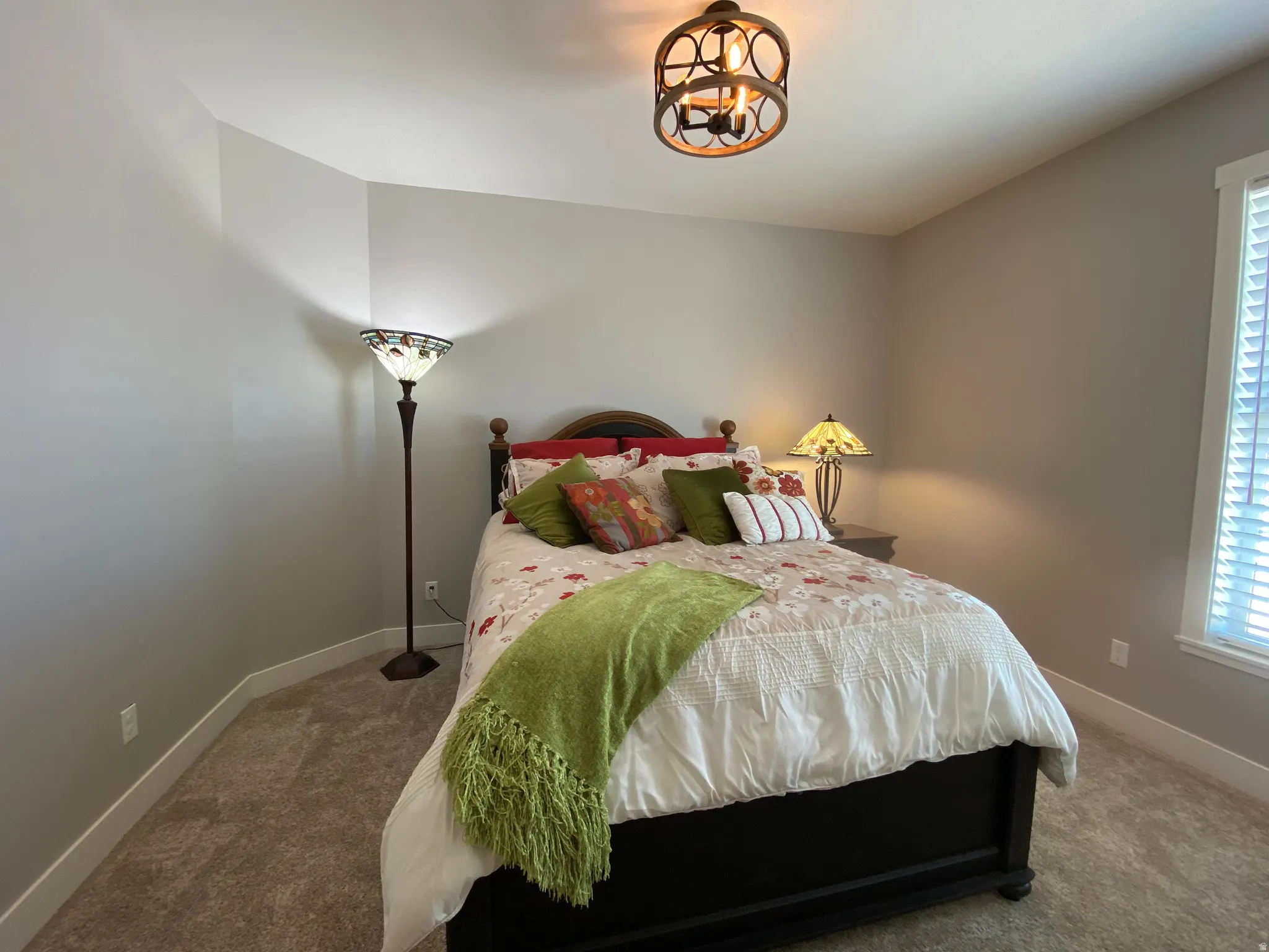 Carpeted bedroom with baseboards