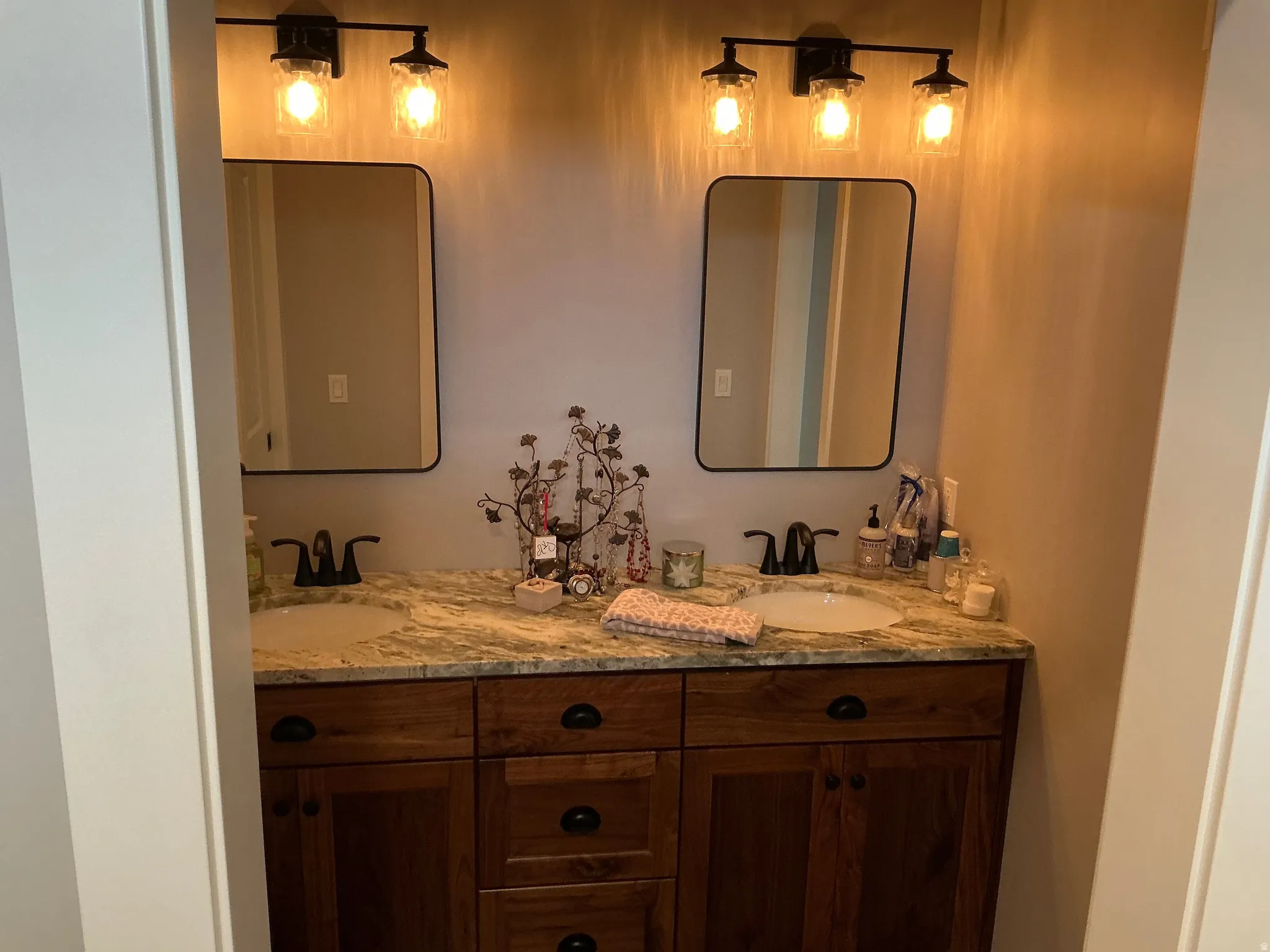 Full bath featuring double vanity