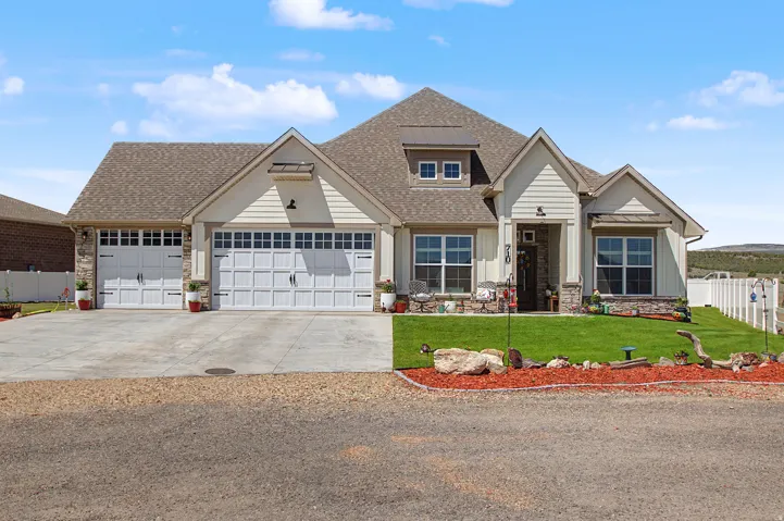 Craftsman-style home featuring a stone and siding exterior, multi-pane windows, and a prominent front entry
