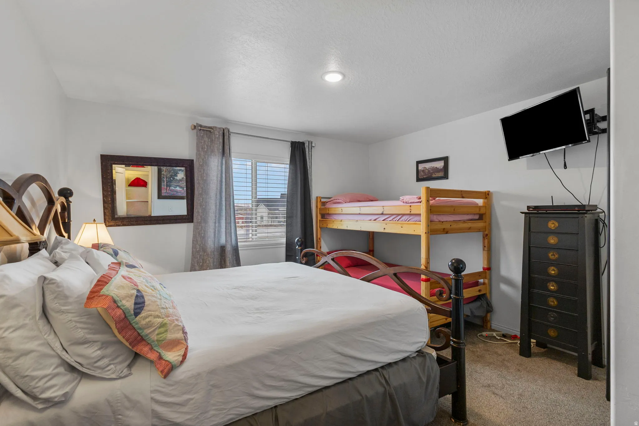 Bedroom with light carpet