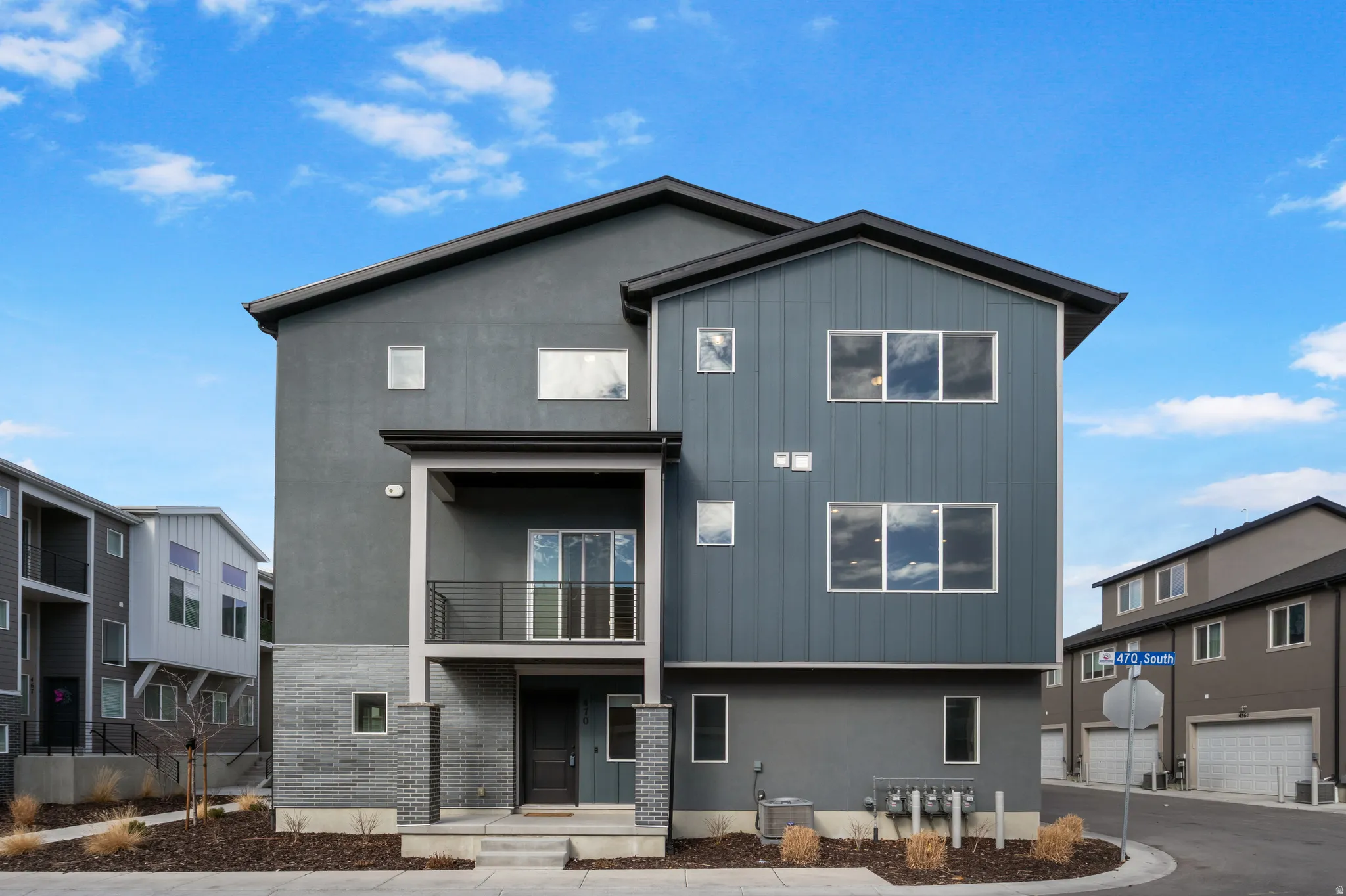 Back of property featuring stucco siding and a balcony