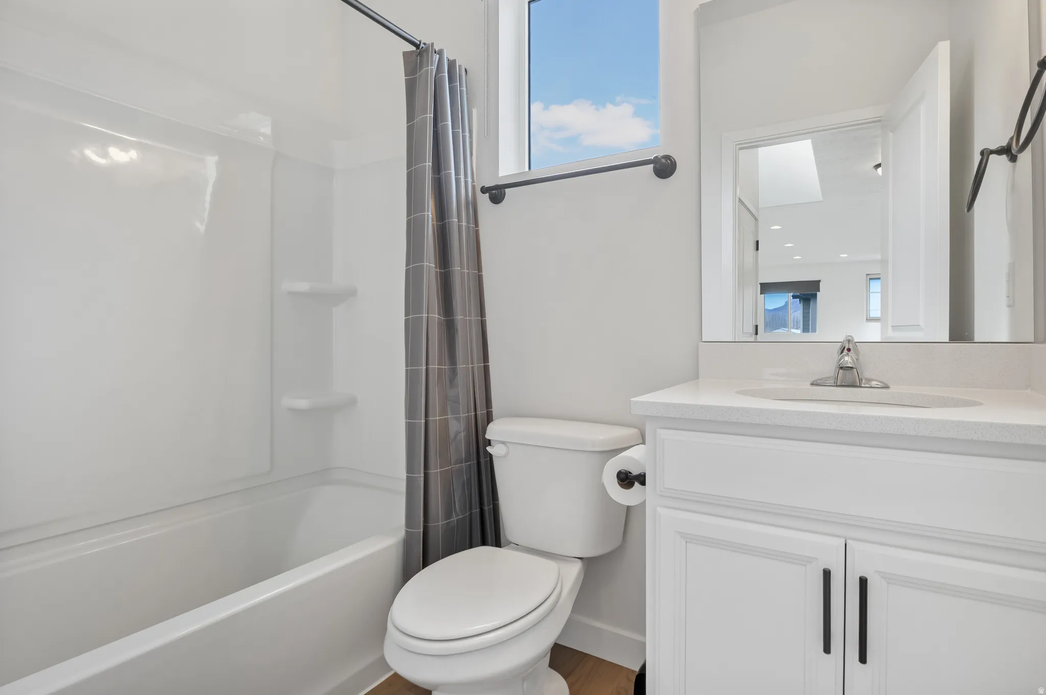 Full bathroom featuring vanity and shower / tub combo