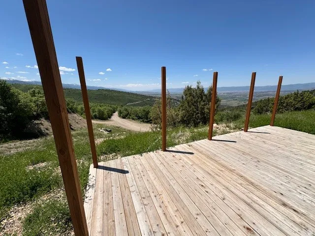 Wooden deck featuring a view of countryside