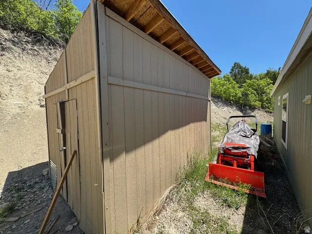 View of home's exterior with a shed