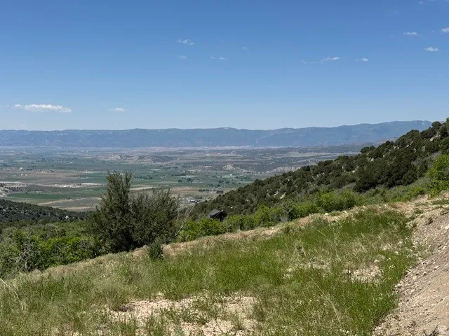 View of mountain background featuring rural landscape