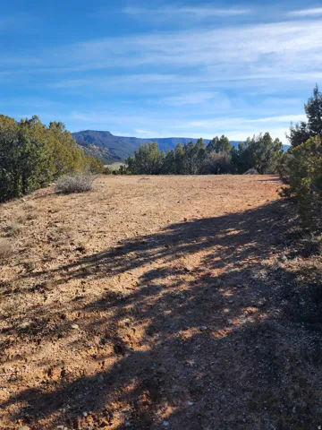 View of mountain backdrop with rural landscape