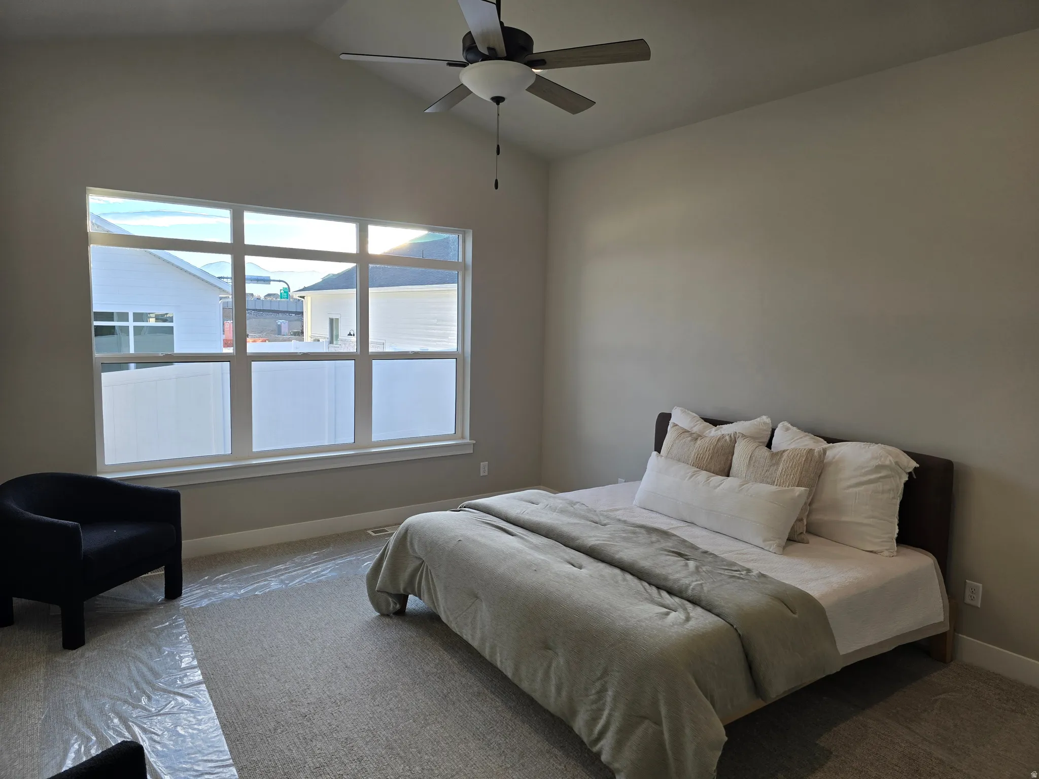 Bedroom featuring ceiling fan and carpet floors