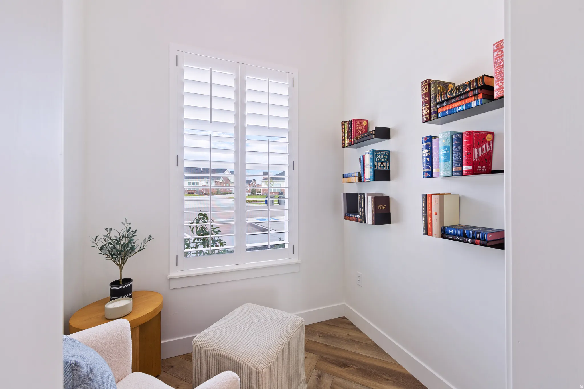 Sitting room featuring wood finished floors and baseboards