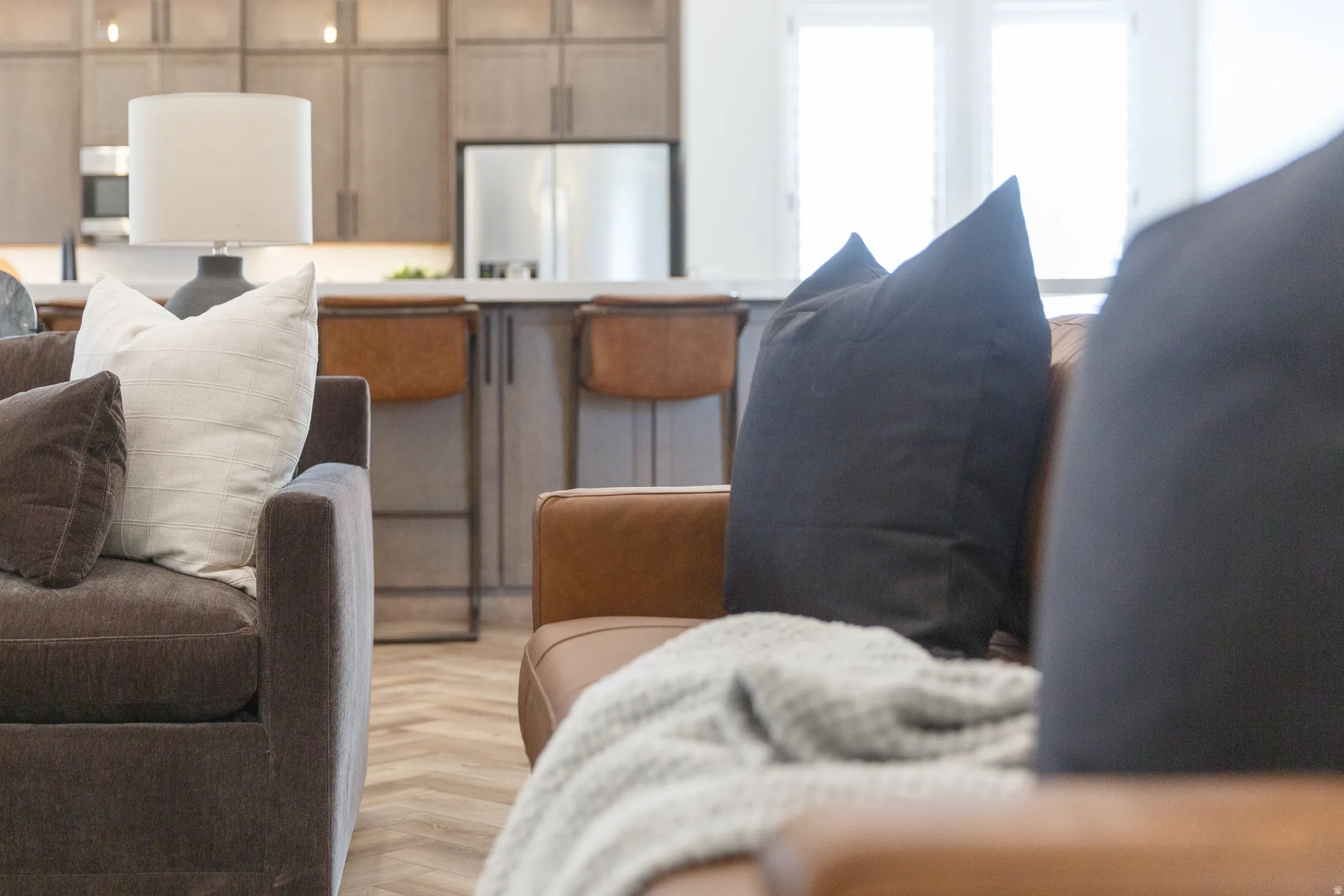 Detailed view of freestanding refrigerator and stainless steel microwave