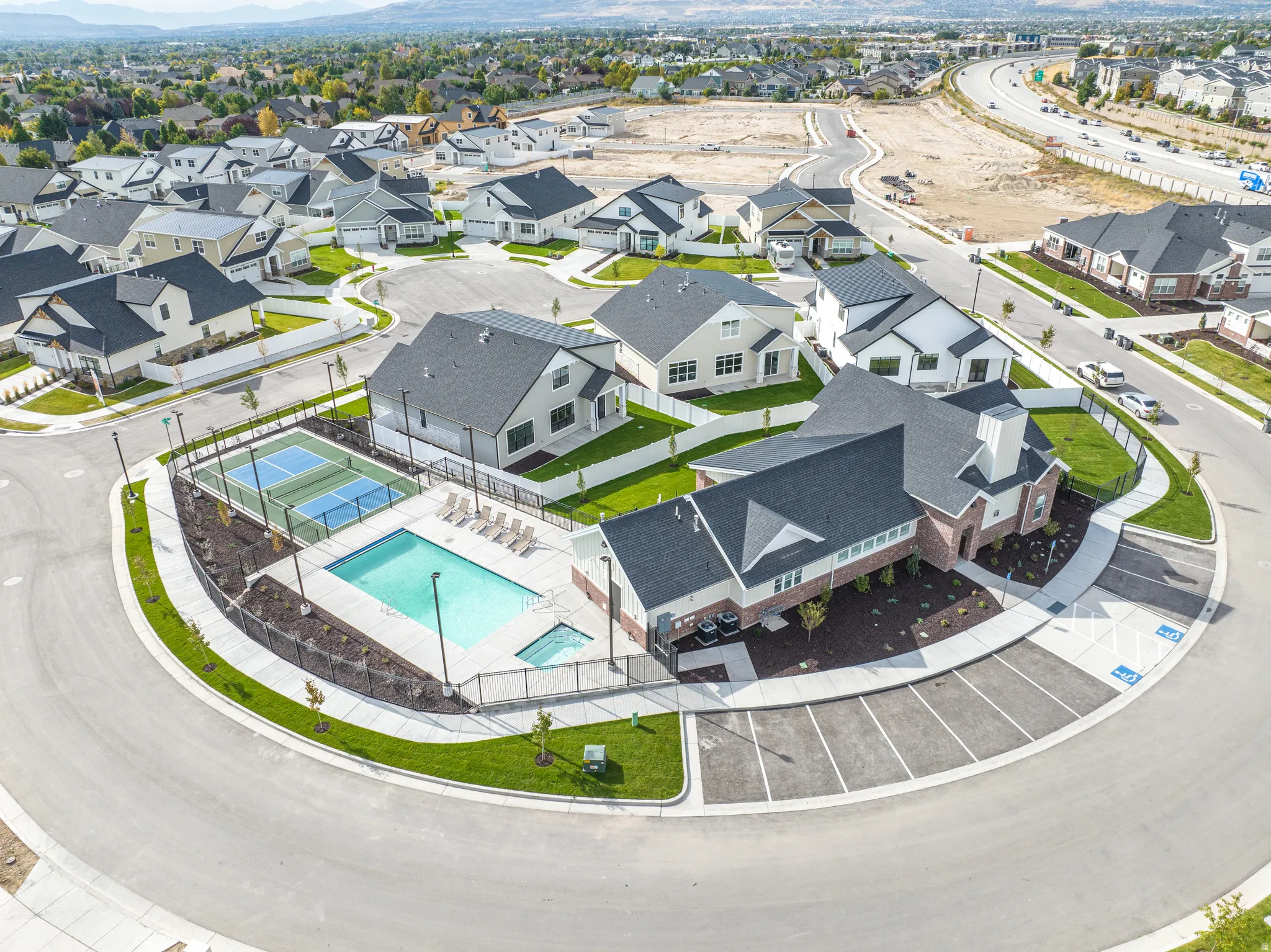 Aerial perspective of suburban area featuring a pool