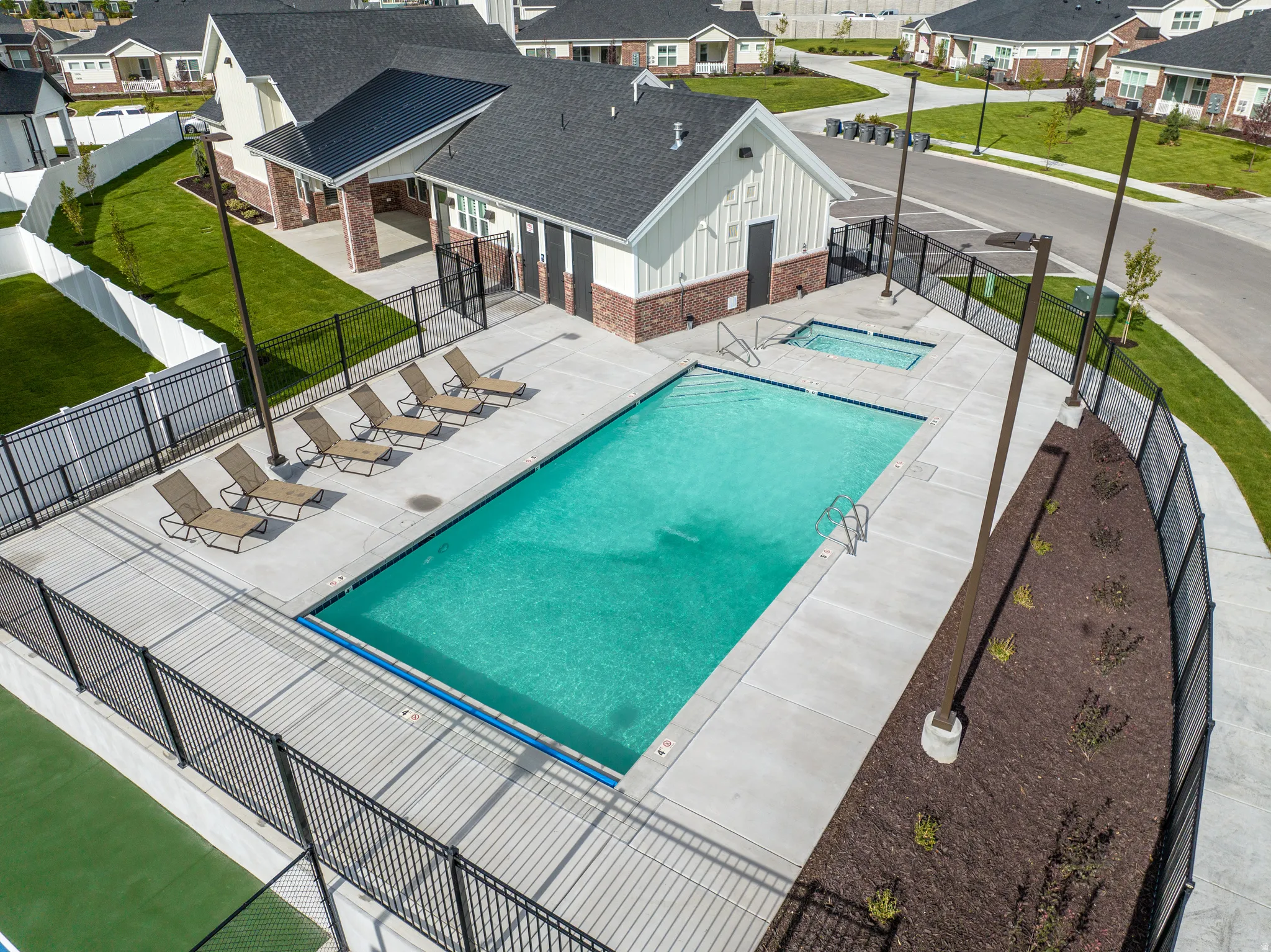 Community pool featuring a patio area and a residential view