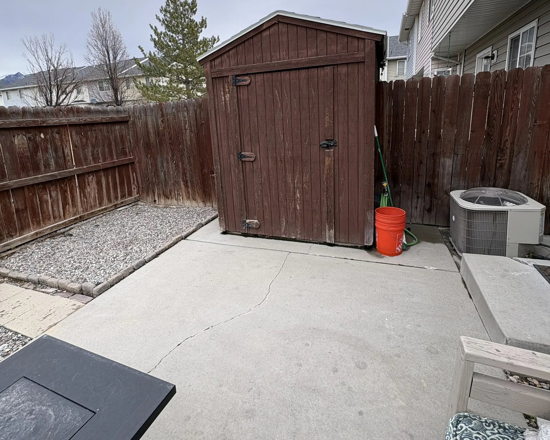 View of shed with a fenced backyard