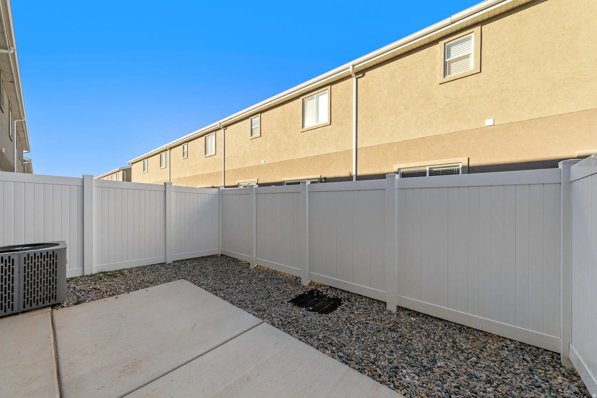Fenced backyard with a patio