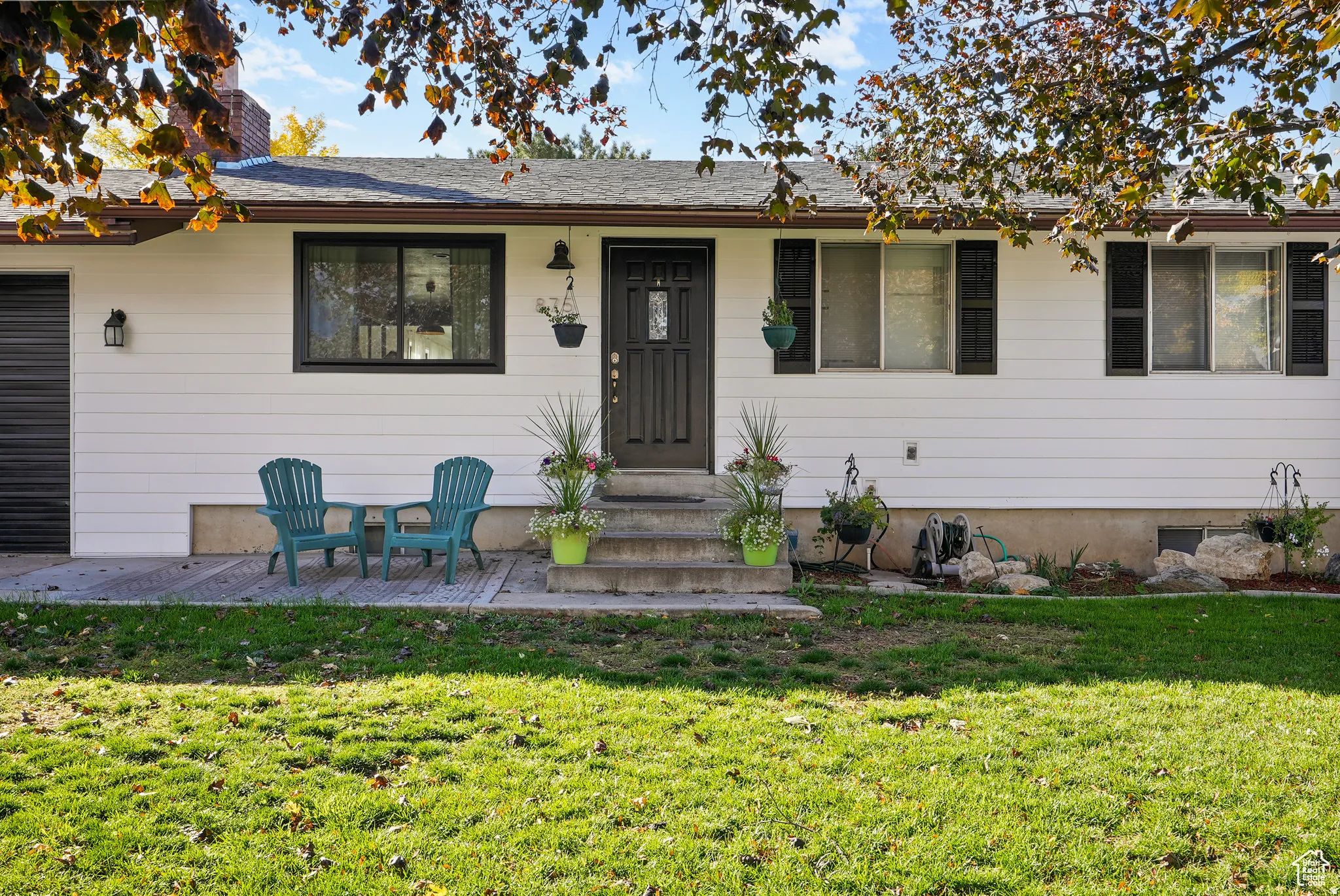 View of front of home featuring a front lawn and entry steps