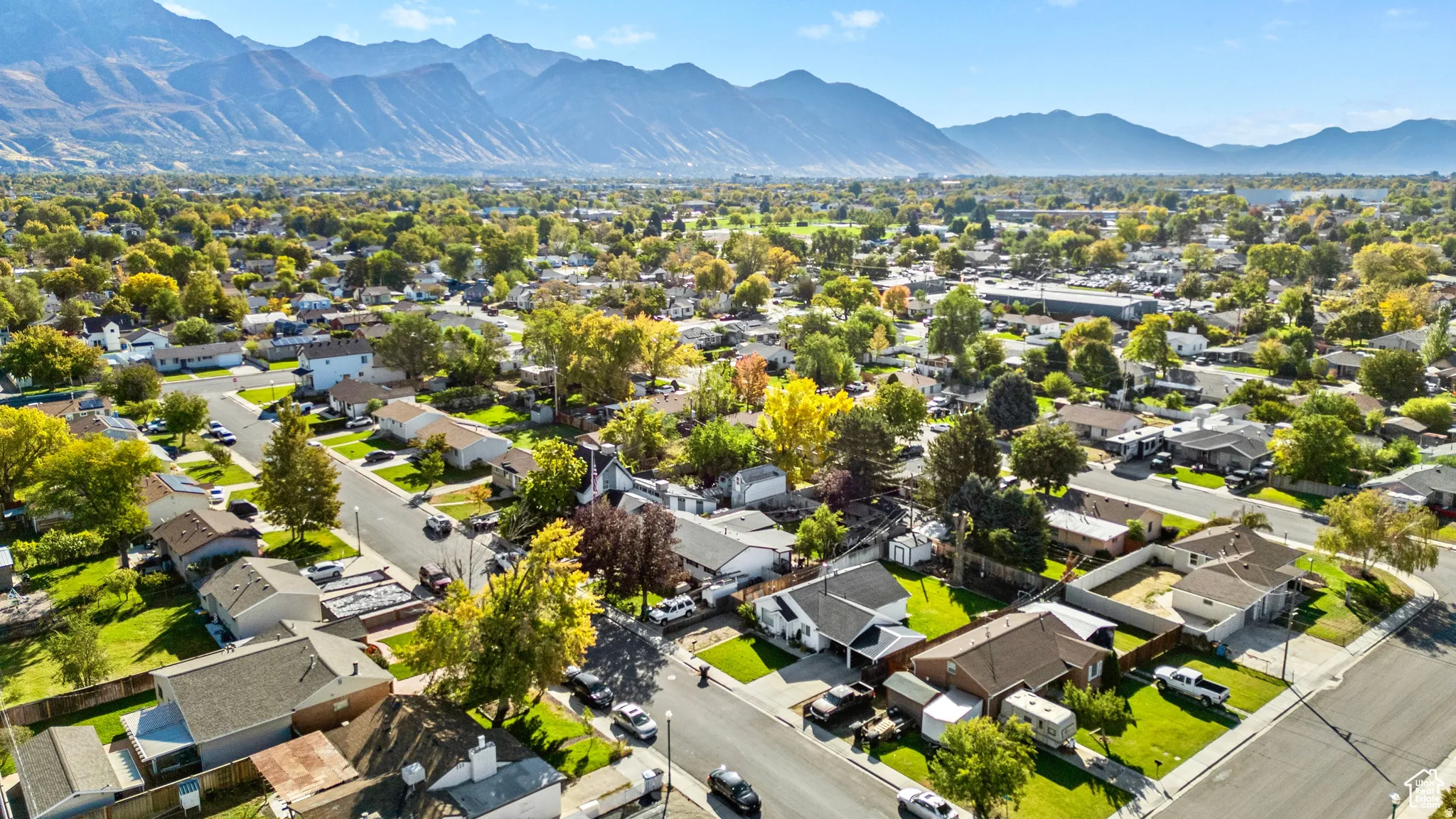 Aerial perspective of suburban area with a mountain backdrop