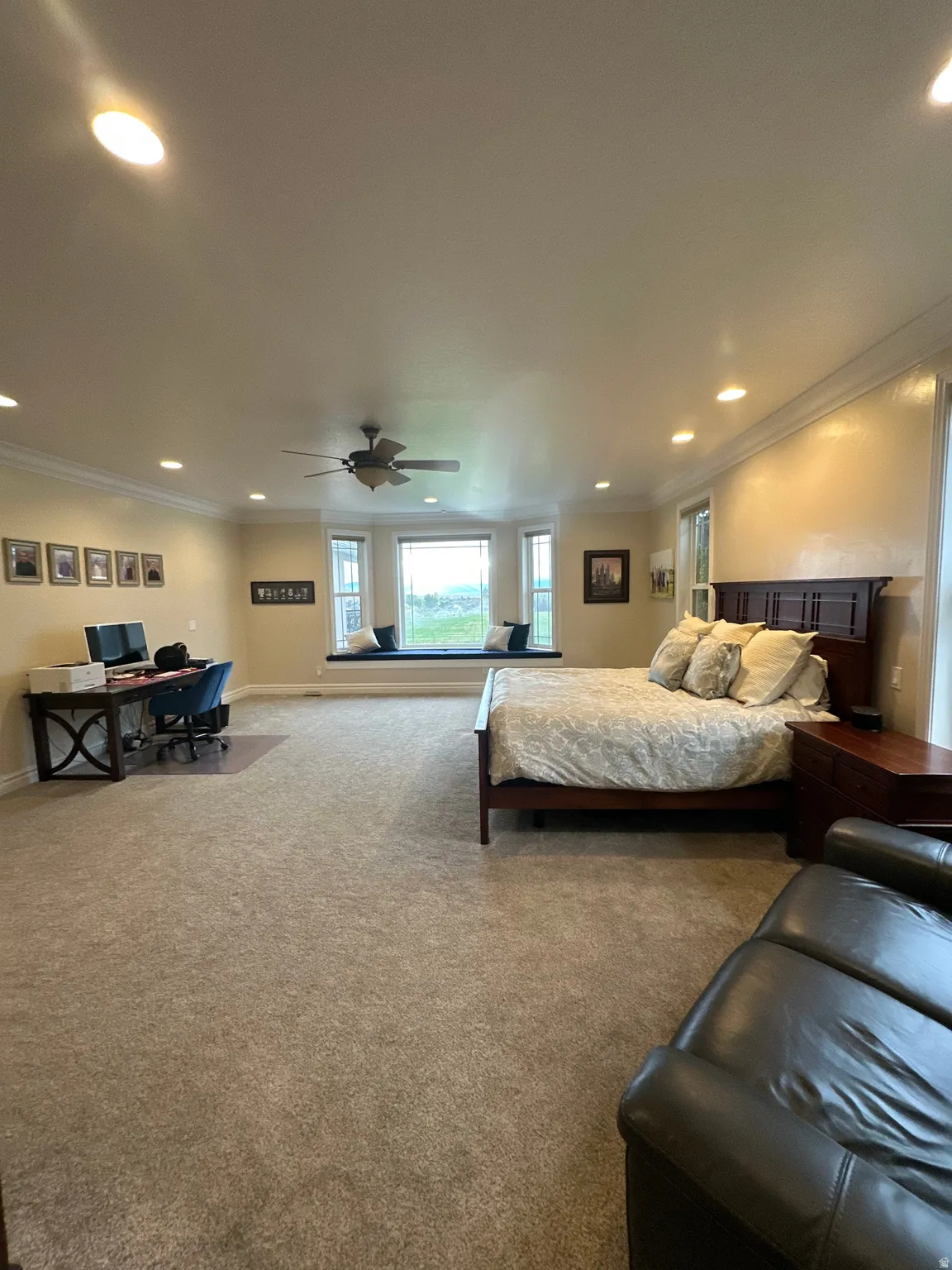 Bedroom with recessed lighting, carpet floors, and ornamental molding